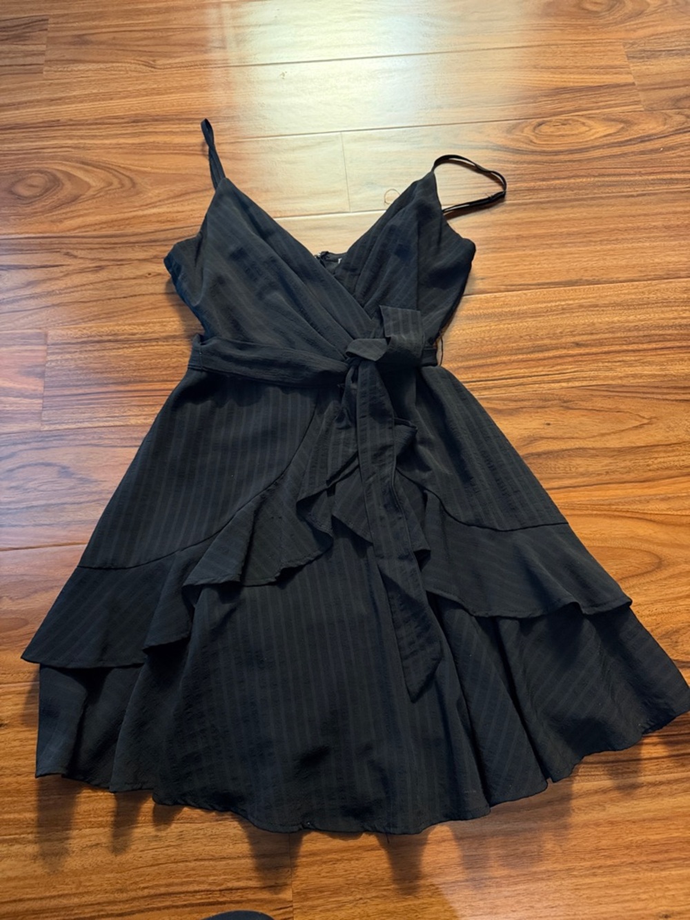 Sleeveless Black Ruffle Wrap Mini Dress with Tie Waist